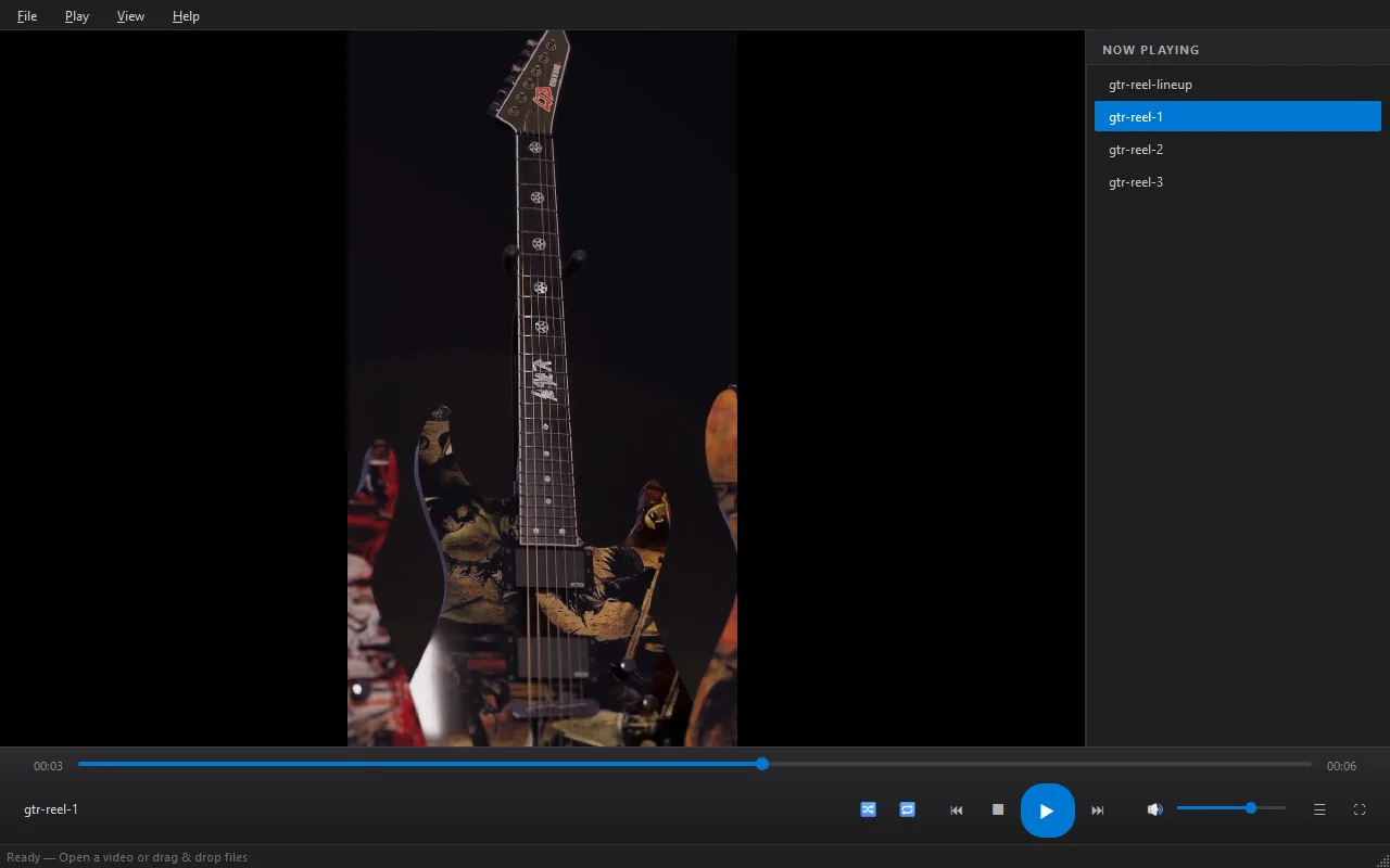 Flux Player playing a portrait guitar reel, with the seek bar, transport controls and Now Playing list